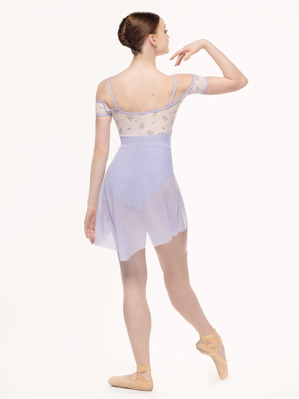 Eleve Dancewear Lola Leotard Kids in  Baby's Breath print and lavender color, back view of dancer posing on tendu front.