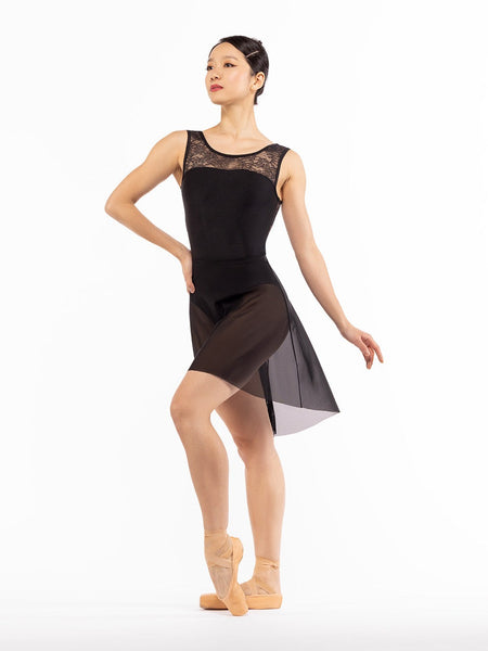 Dancer is facing front with one hand on the hip and one leg on point crossed in front, wearing a Back Tuck Skirt Black Mesh RTW.