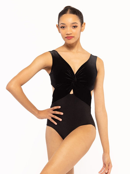 Dancer is facing front with one hand on the hip, wearing a Jackie Leotard Black Velvet RTW.