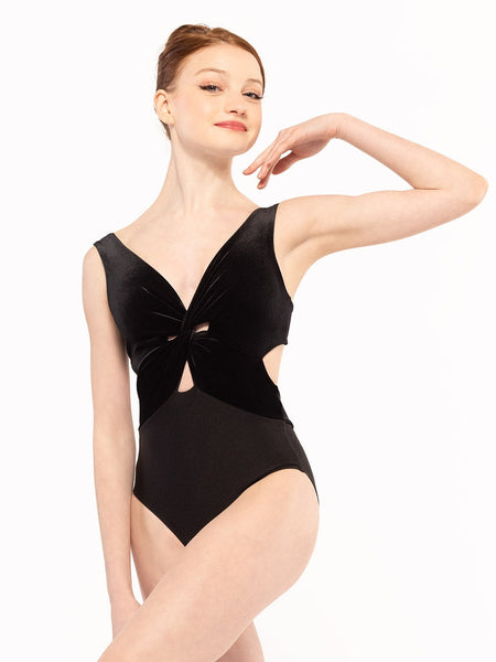 Dancer face front with one hand on the shoulder one leg crossed, wearing Jackie Leotard Black Velvet RTW.