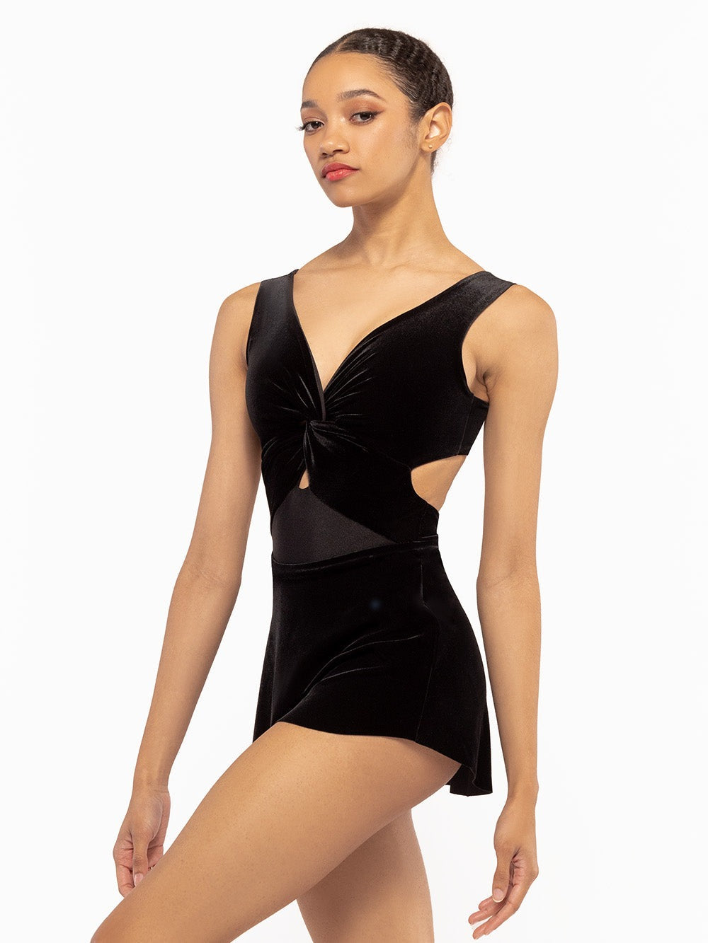 Dancer is facing front with one leg crossed showing neckline detail of the Jackie Leotard Black Velvet RTW.