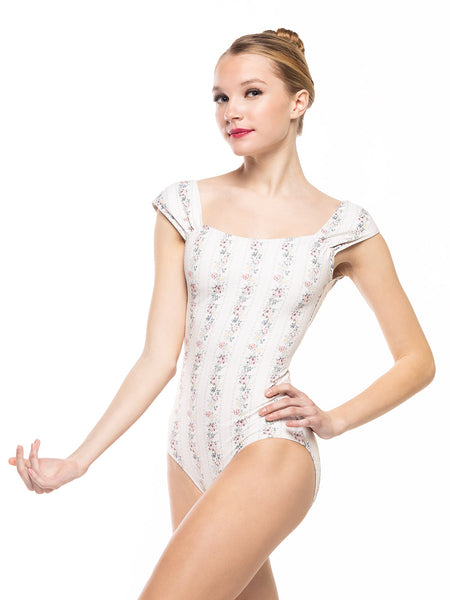 Dancer is facing front with one arm on the hip, wearing a Angelina Leotard Delightful RTW.