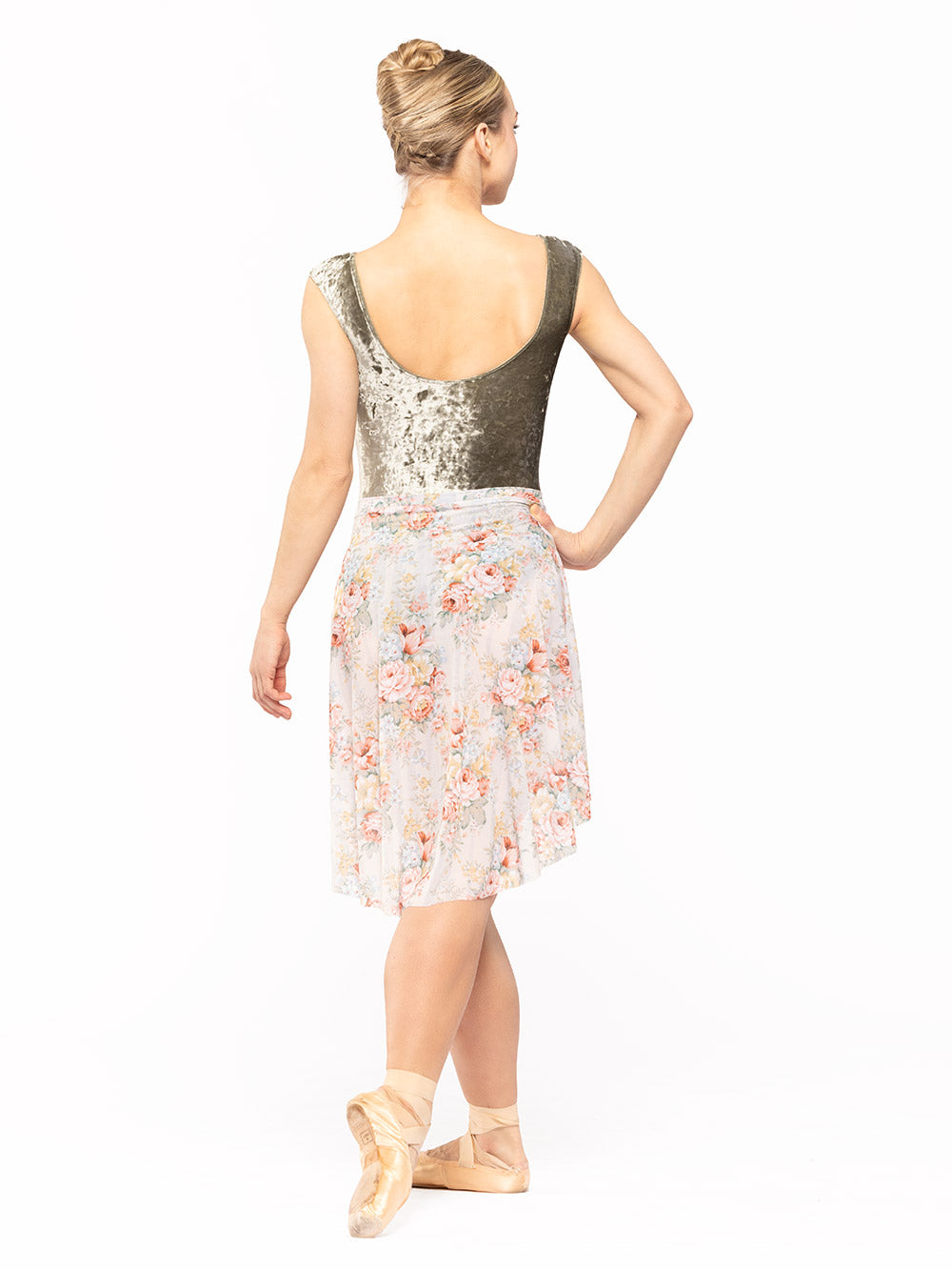 Dancer is facing back with one arm on the hip and cou-de-pie flat derriere, wearing a Long High-Low Skirt Endless Love Mesh RTW.