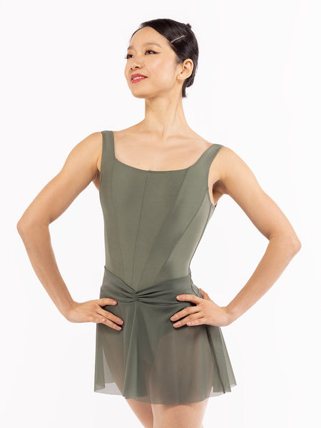 Dancer is facing front with both arms on the hips, wearing a Amora Skirt Dusty Olive Mesh RTW.