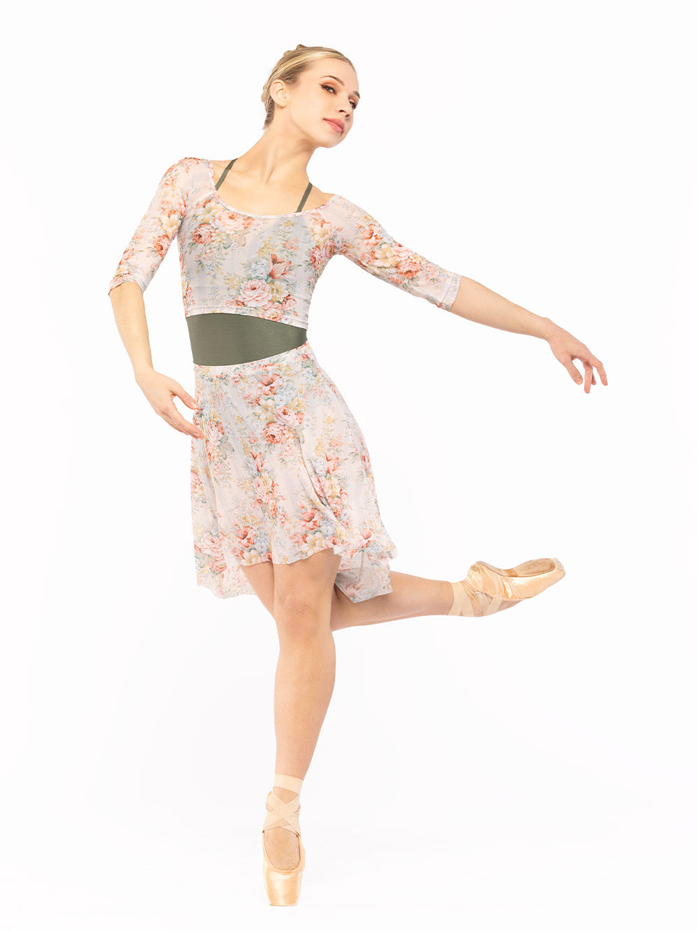 Dancer is diagonal front on point and one leg on past passe to the knee and arms lower in epaulement, wearing a Long High-Low Skirt Endless Love Mesh RTW.