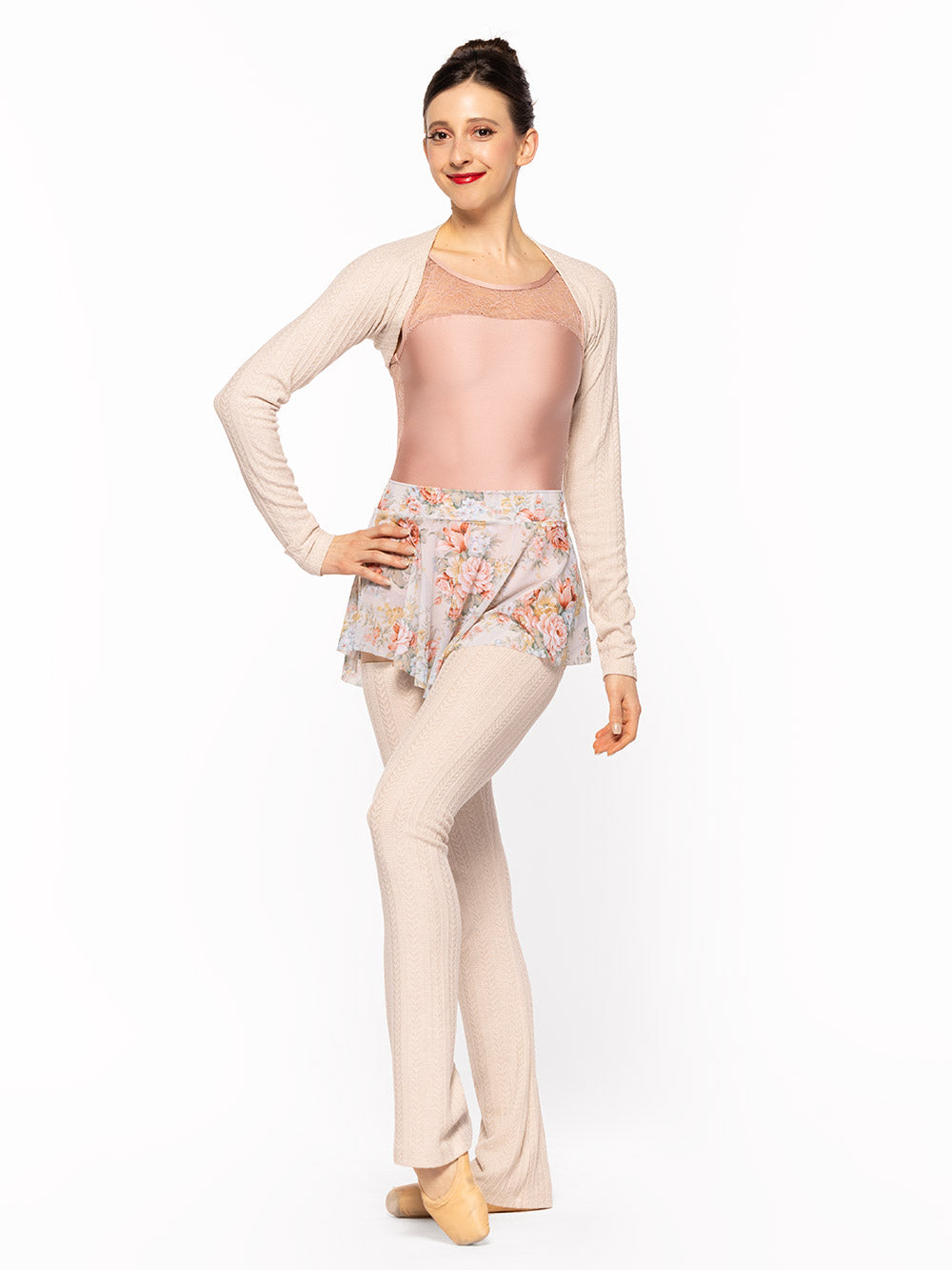 Dancer is facing front with one arm on the hip and one leg resting on point, wearing a Ida Leotard Rosewater Lace RTW.
