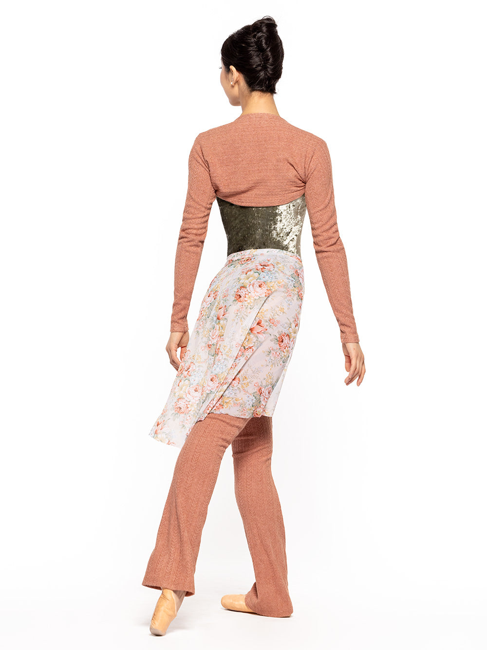 Dancer is facing diagonal back on tendu crossed derriere with arms resting down, wearing a Long High-Low Skirt Endless Love Mesh RTW.