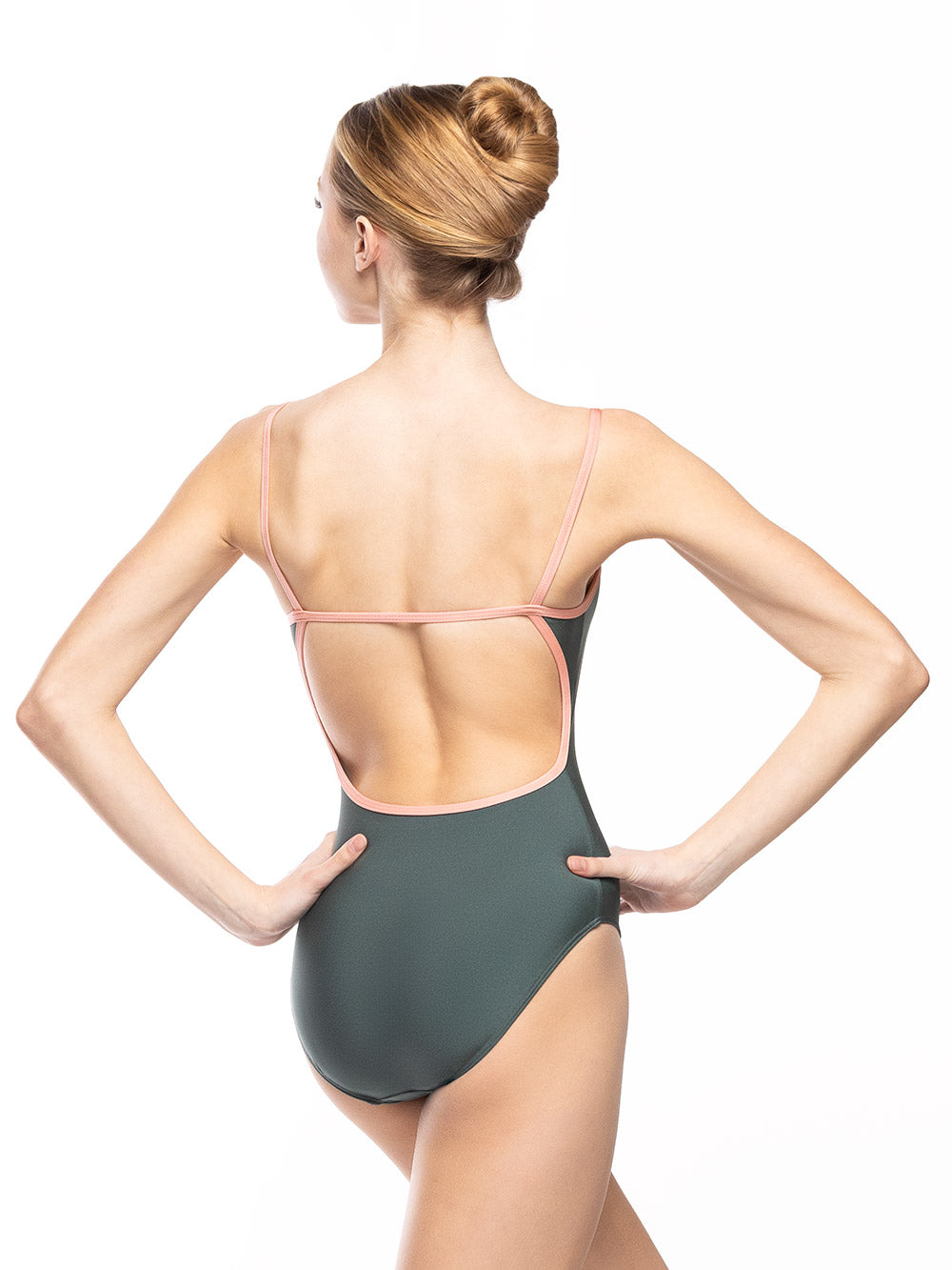 Dancer is facing back with both hands on the hips, wearing a Candy Leotard Plate Cacti RTW.