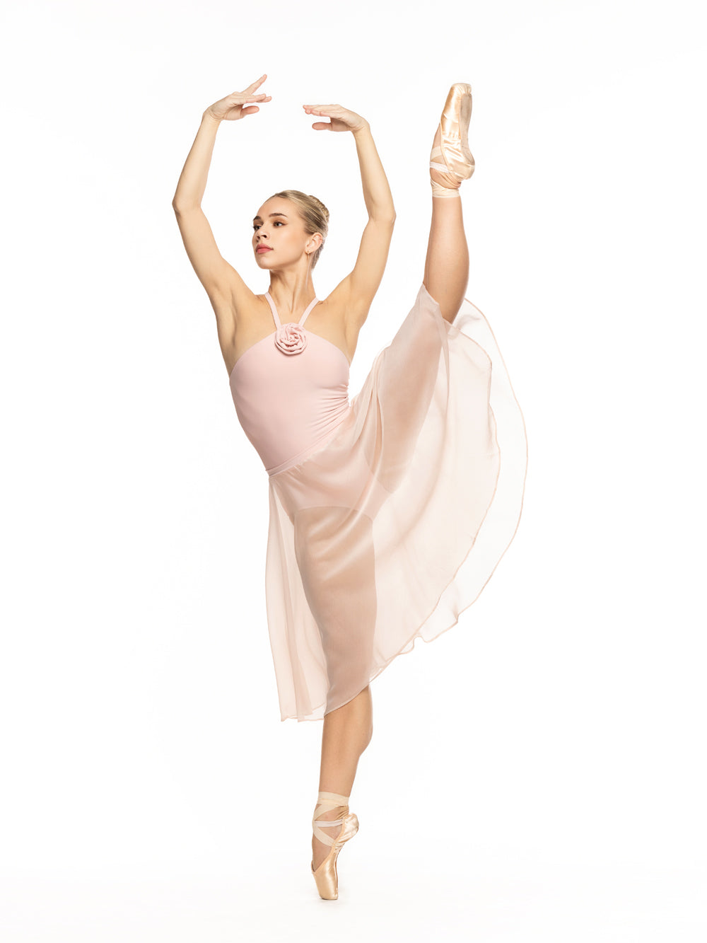 Dancer is facing front on high a la seconde leg on point with arms on fifth position, wearing a Chiffon Rehearsal Skirt Powder Pink RTW.