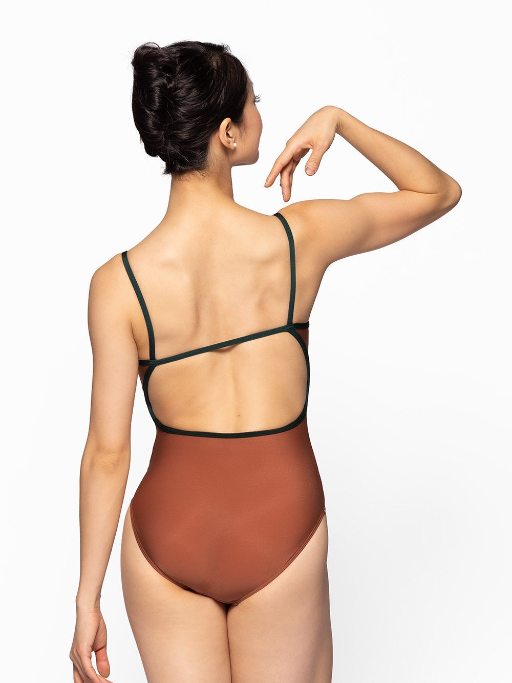 Dancer is facing back with one arm to the shoulder, wearing a Candy Leotard Spice RTW.