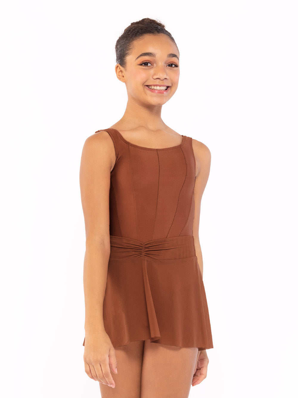 Dancer is facing front with arms resting down, wearing a Amora Skirt Spice Mesh RTW.