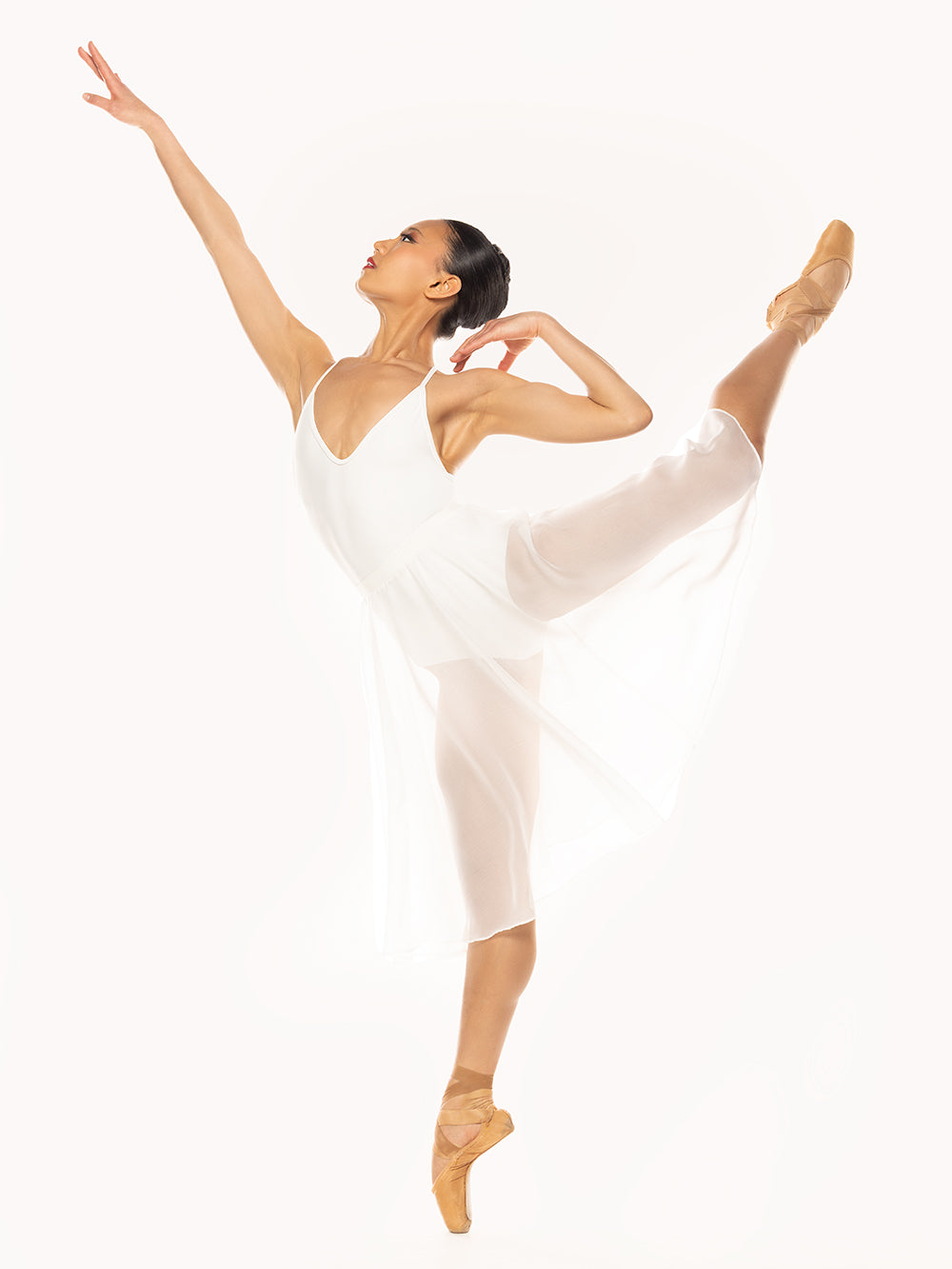 Eleve Dancewear Chiffon Rehearsal Skirt Stage Kids in White color, arabesque on attitude profile view.