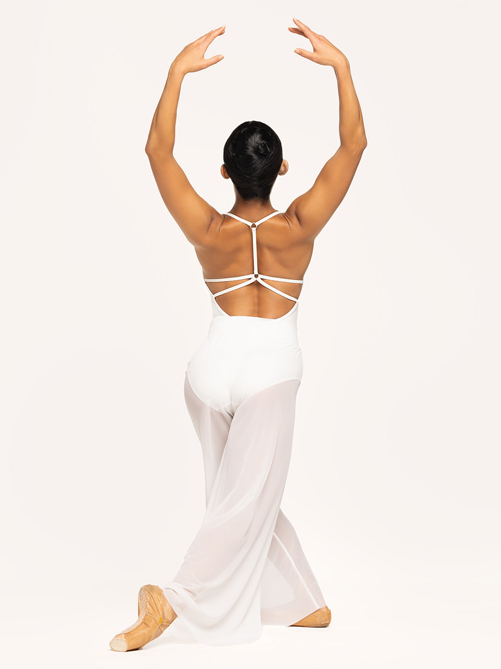 Eleve Dancewear Iris Leotard in Stage White color and A Line Pants in white mesh color with back view of model posing.