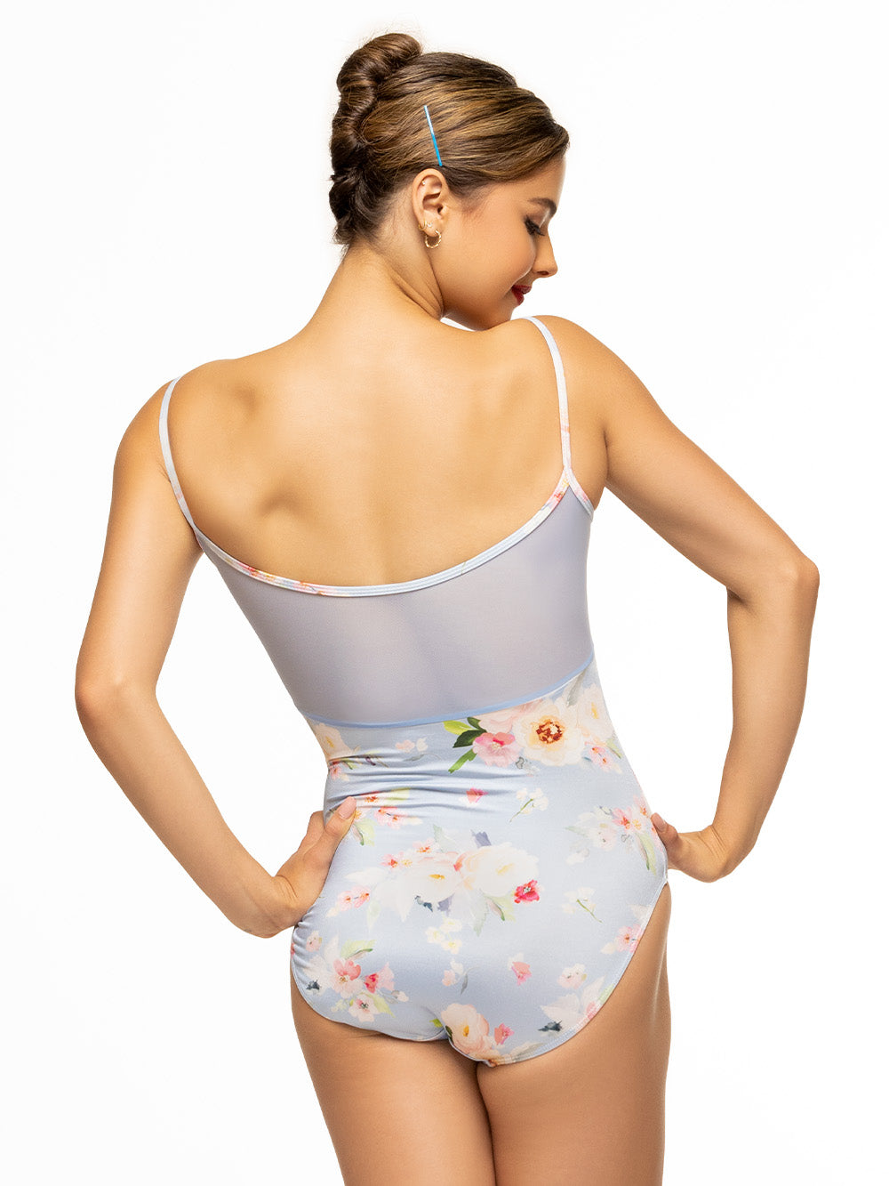 Back of model wearing light blue floral print bodysuit with gathered front and mesh back.