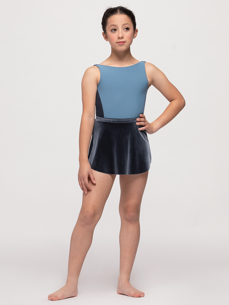 Model standing in blue gray velvet skirt and leotard with matching side panel 