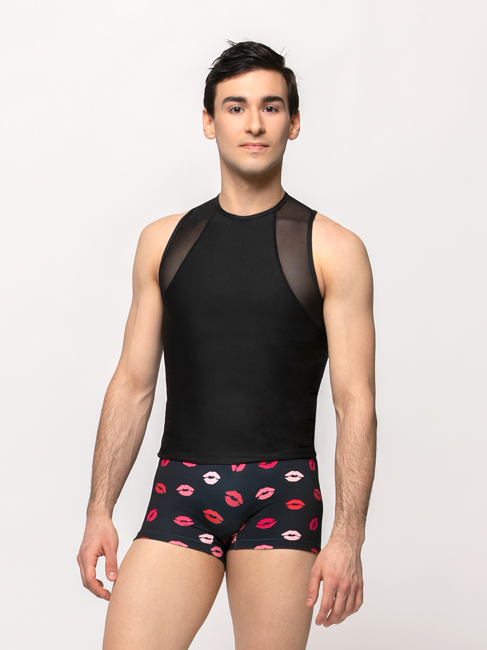 Model wearing a tight dance shirt with mesh detail