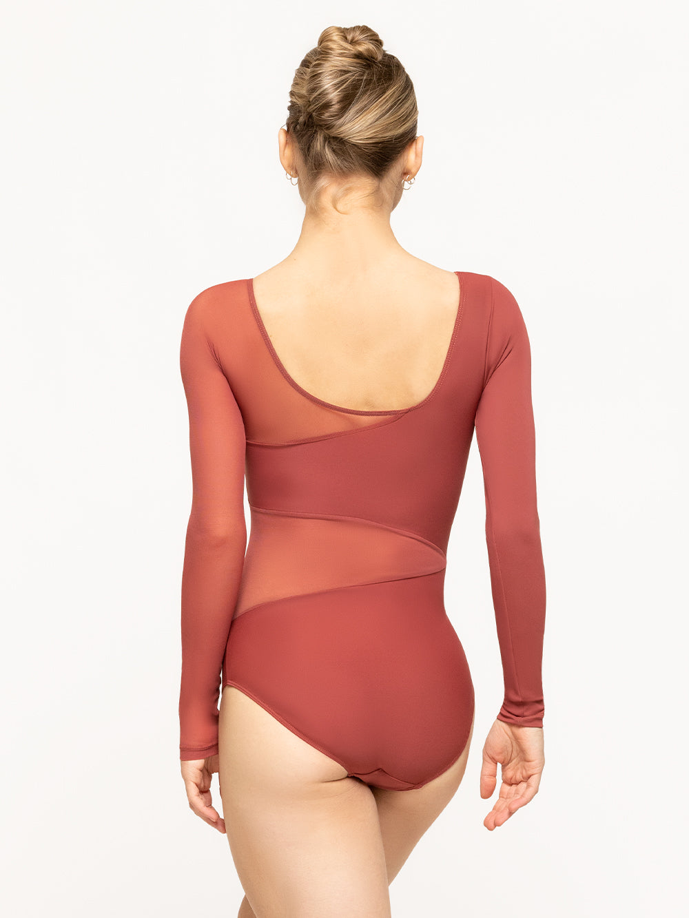 Back of Model is in leotard with contrasting Cinnamon solid and Cinnamon mesh full length sleeves and a wrap around mesh waist detail