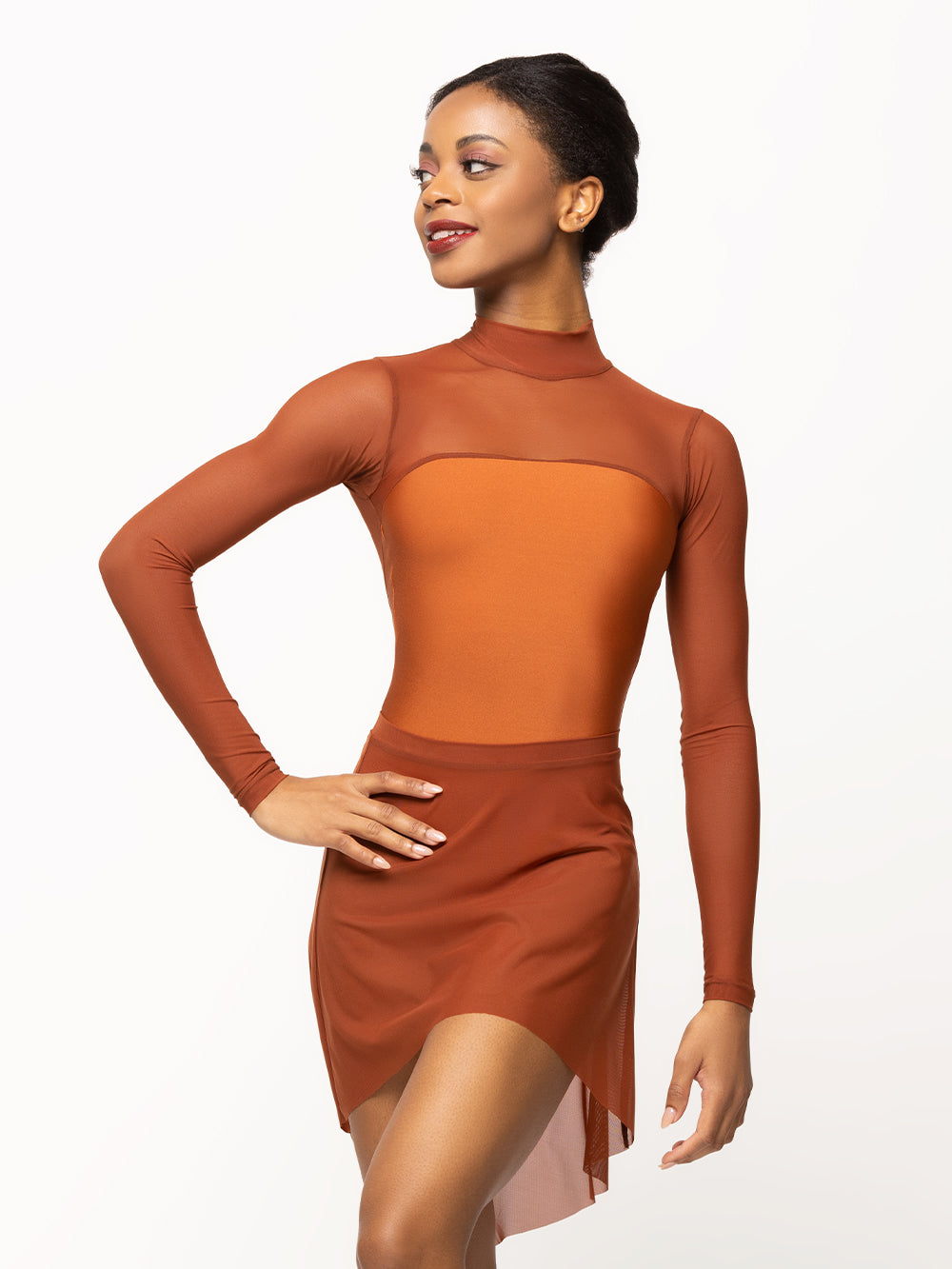 Back of Model is in shiny copper leotard with mesh sleeves and matching copper mesh skirt