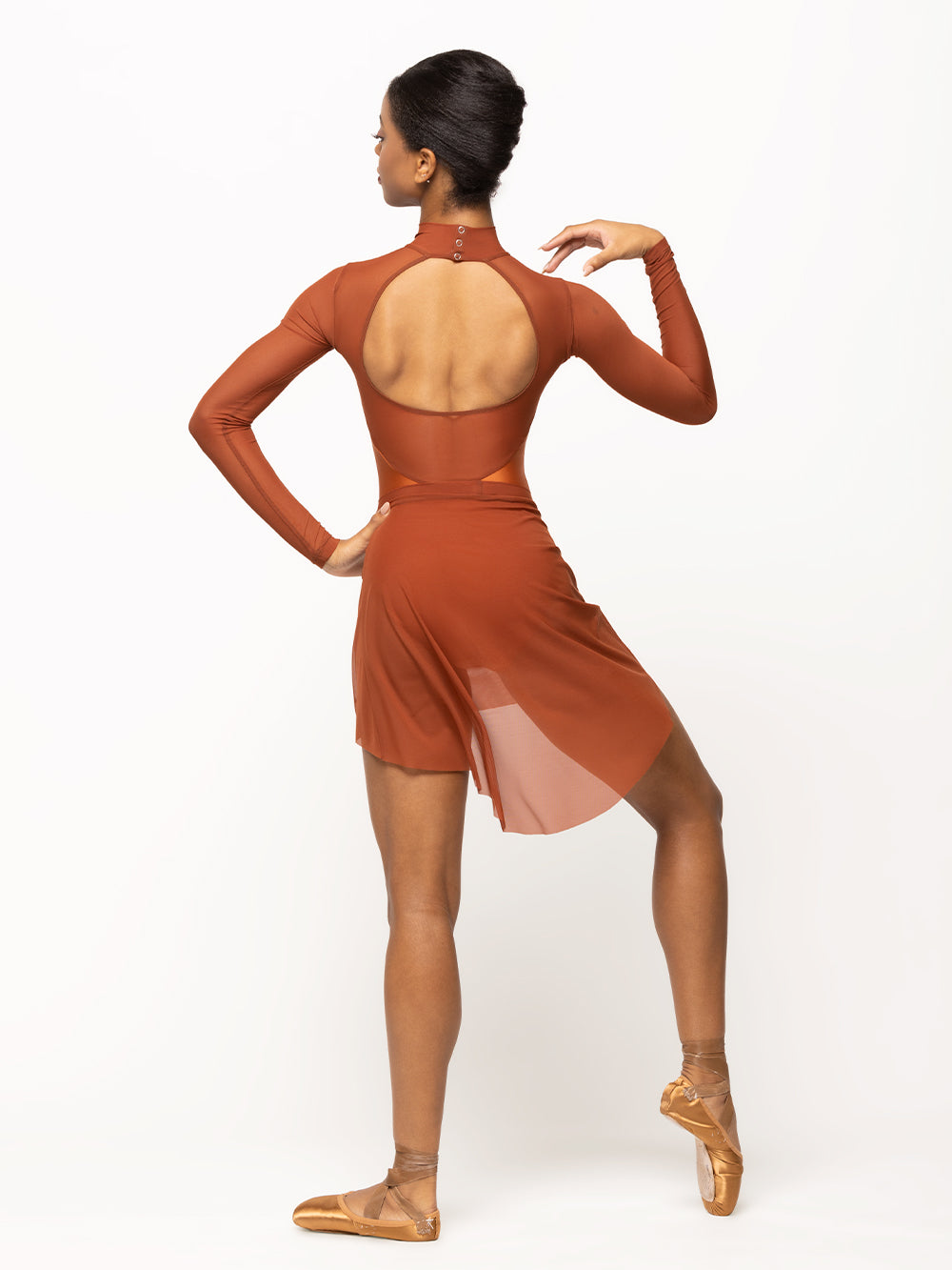 Back of Model is in shiny copper leotard with mesh sleeves and matching copper mesh skirt