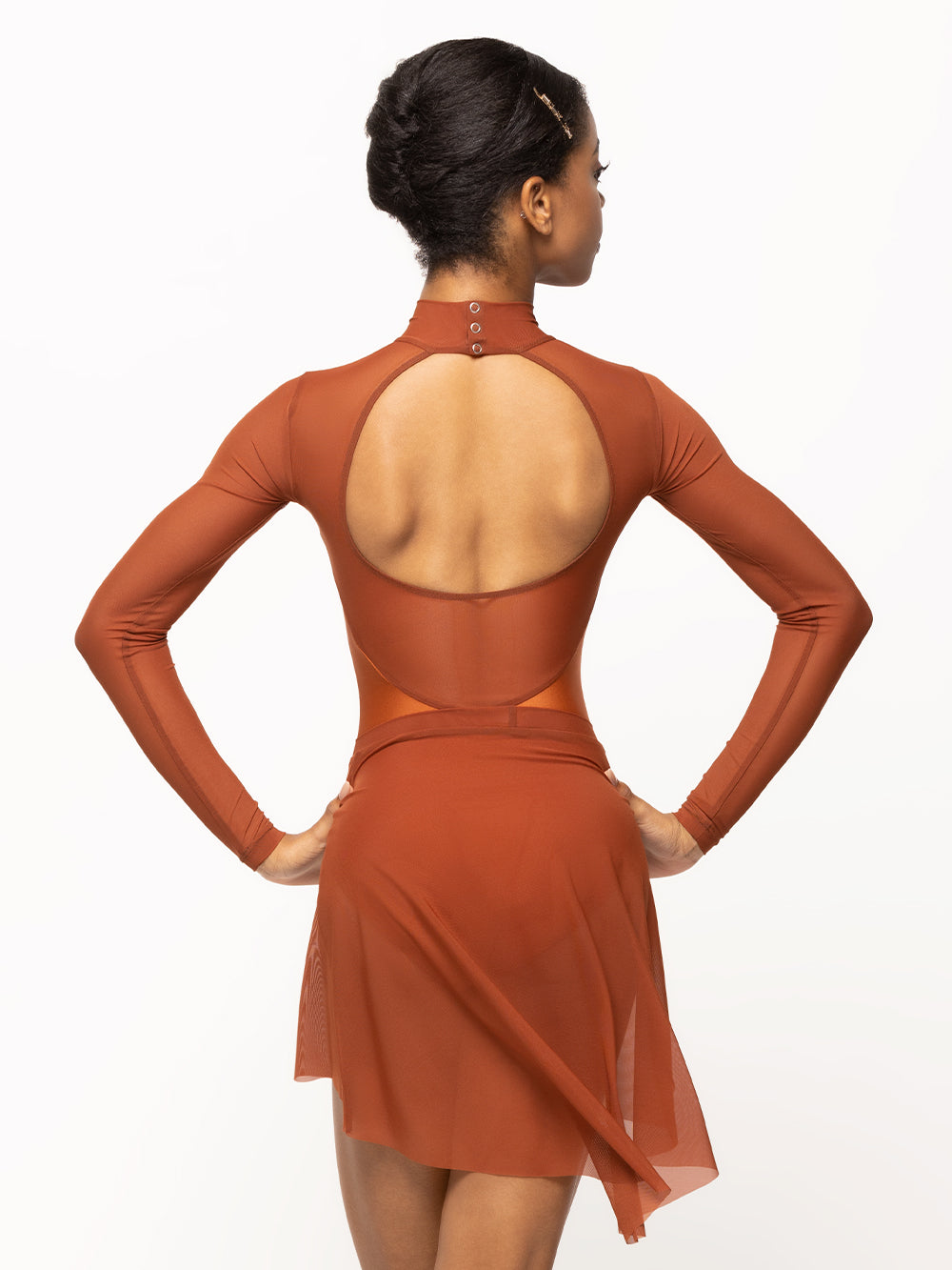 Back of model wearing a shiny Copper orange leotard with Picante orange mesh sleeves, high neck, and open back and a matching Picante mesh skirt