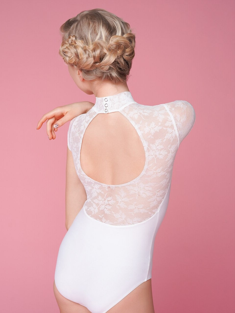 Model is wearing a white lacy mesh leotard