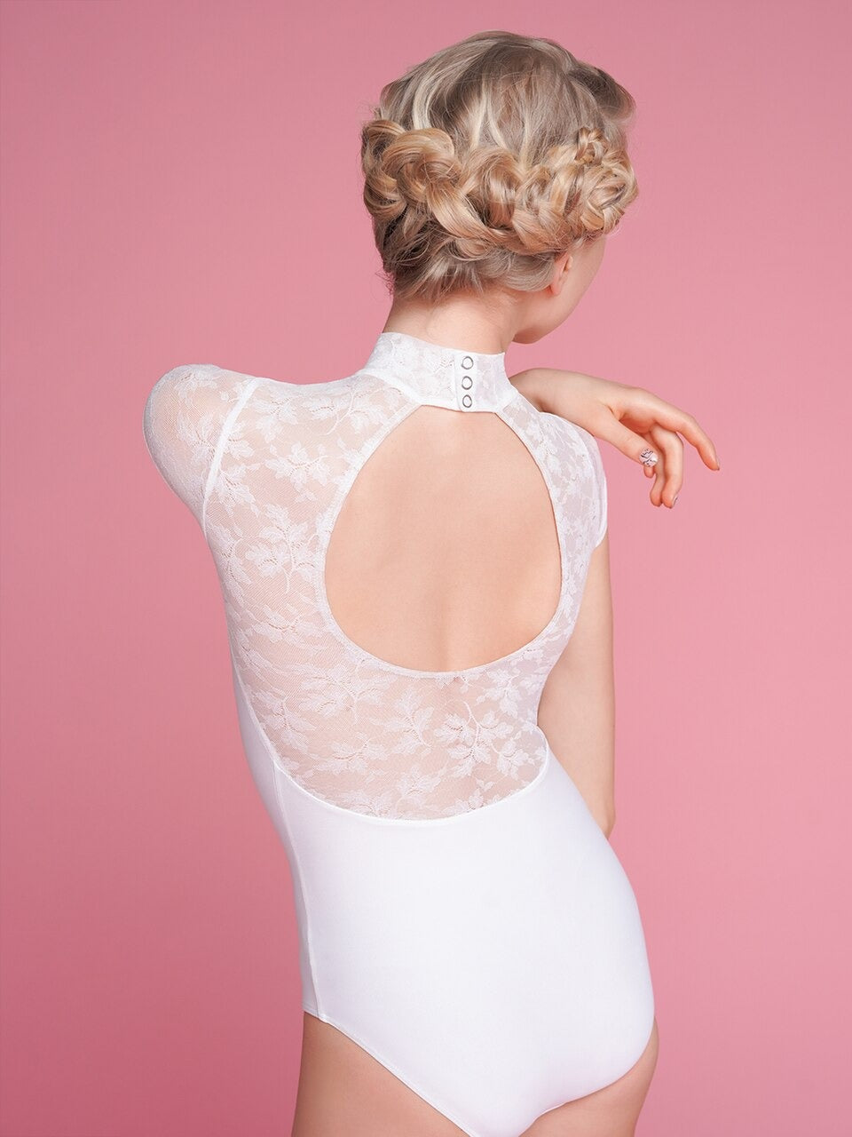 Model is wearing a white lacy mesh leotard