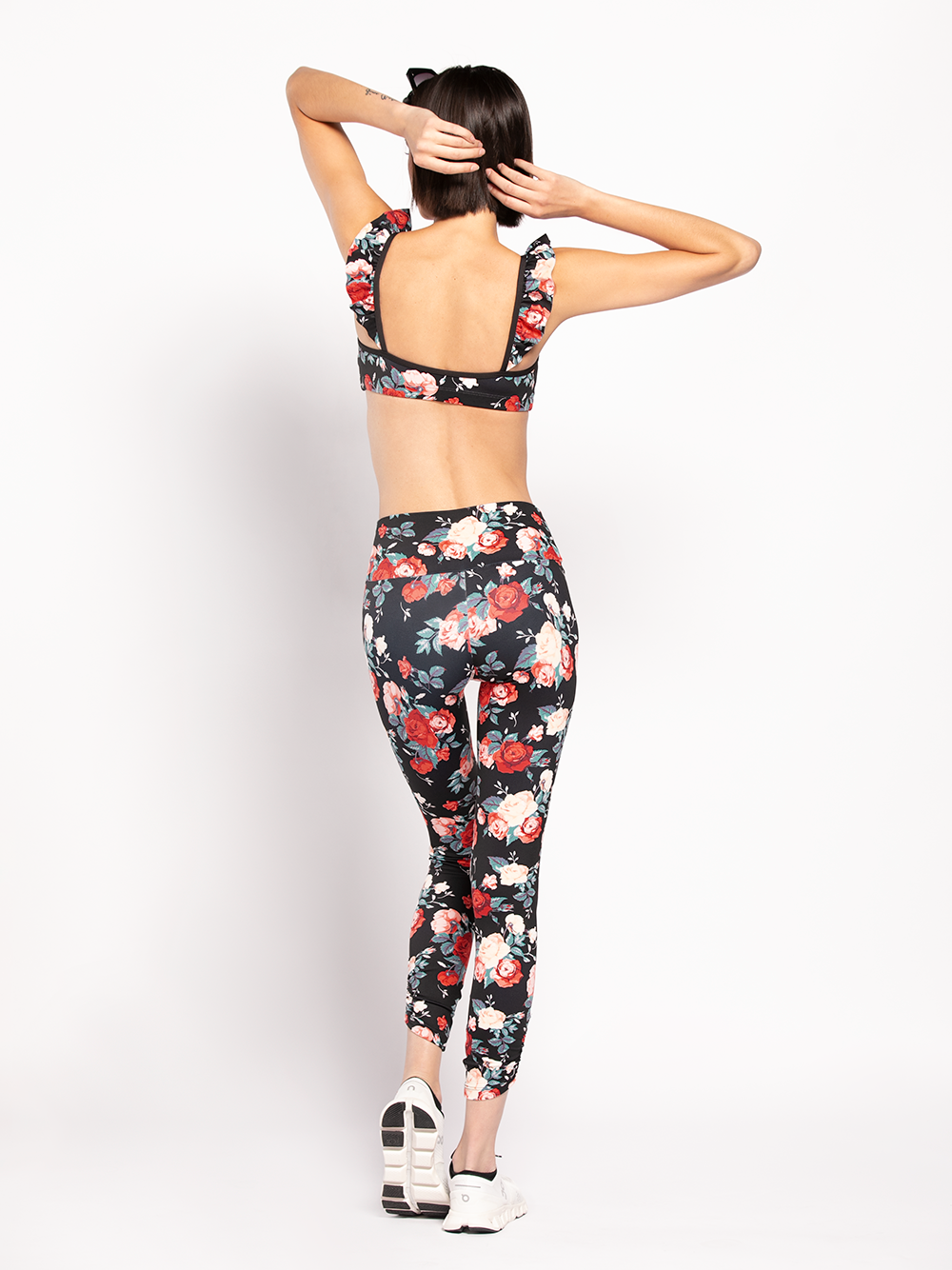 Back of Model In Floral pattern Crop top and matching tights