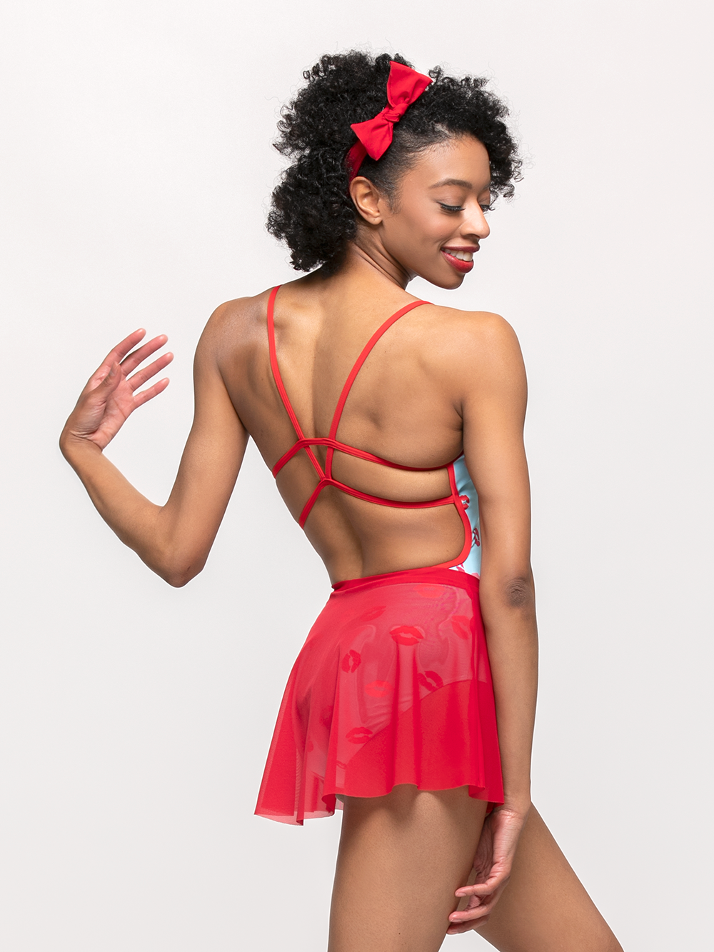 Model showcasing back of flare mesh skirt