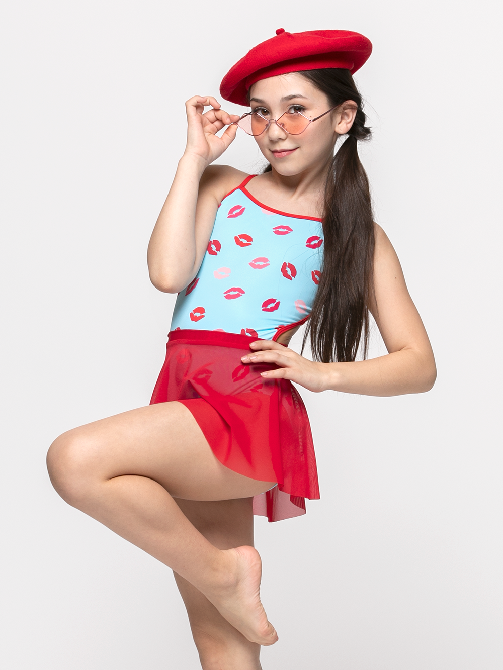 model in red flare mesh skirt
