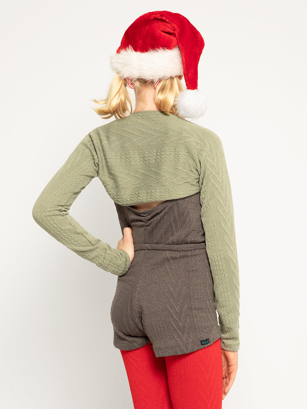 Model is in knitted Charcoal shortie with sage shrug and long red legwarmers
