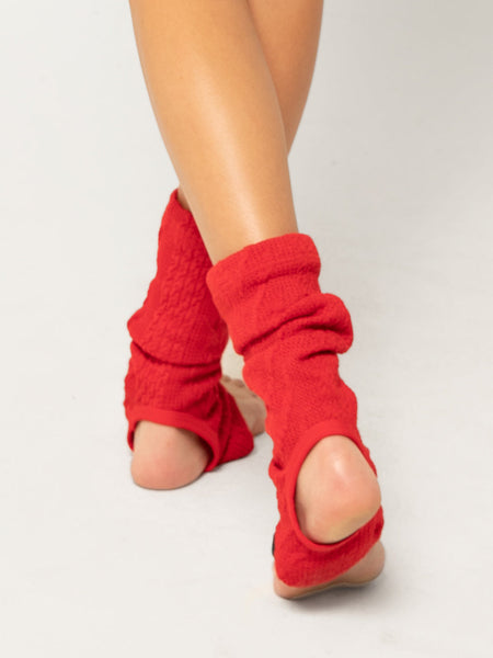 Model is in red ankle length leg warmers 