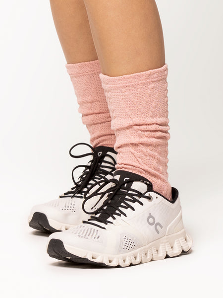 Front of stirrup leg warmers in ankle cable knit rose