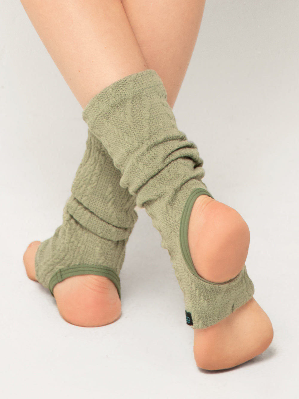 Model  is in ankle length leg warmers in sage
