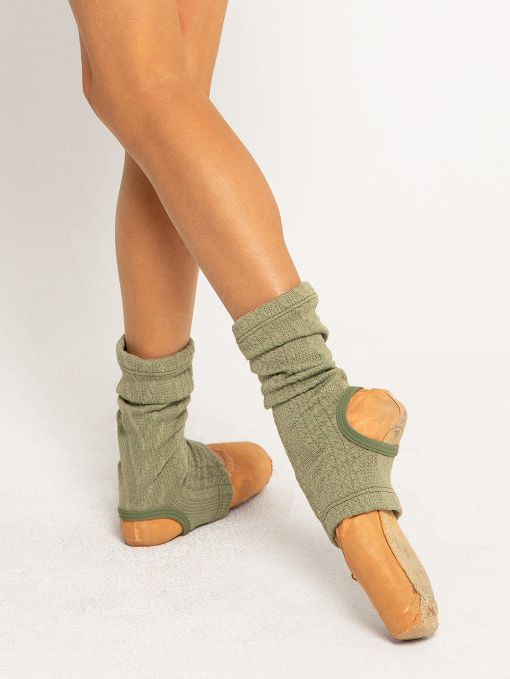 Model is in asage ankle warmers and Charcoal Knit shortie with sage shrug and red long leg warmers