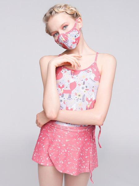 Model wearing a fox pattern leotard with a matching pink floral wrap skirt