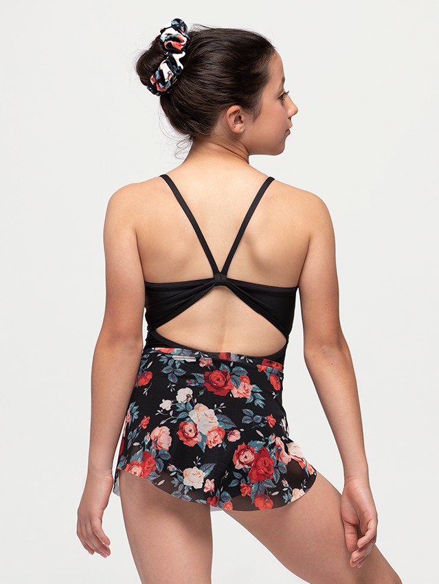 Model showcasing back of black leotard and mesh skirt