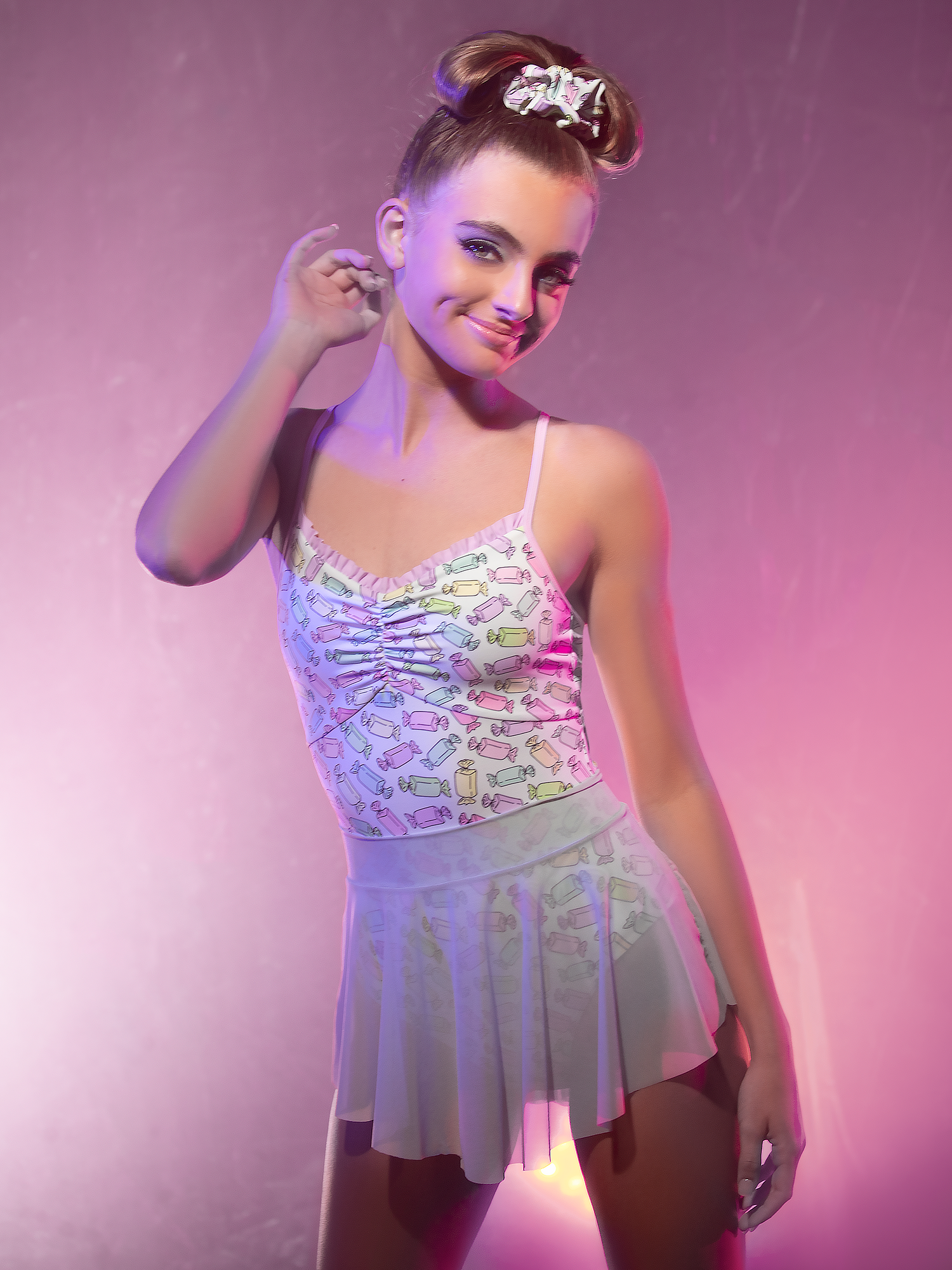 Front view of Model in leotard with colorful foil wrap candy and sea glass colored mesh skirt