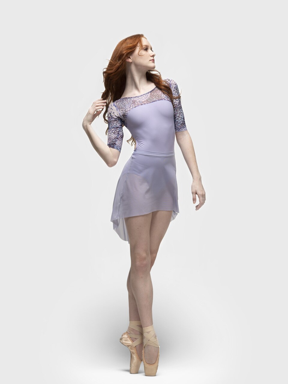 Eleve Dancewear Mid High-Low Skirt  Mesh in Lavender color, front-diagonal full body view.