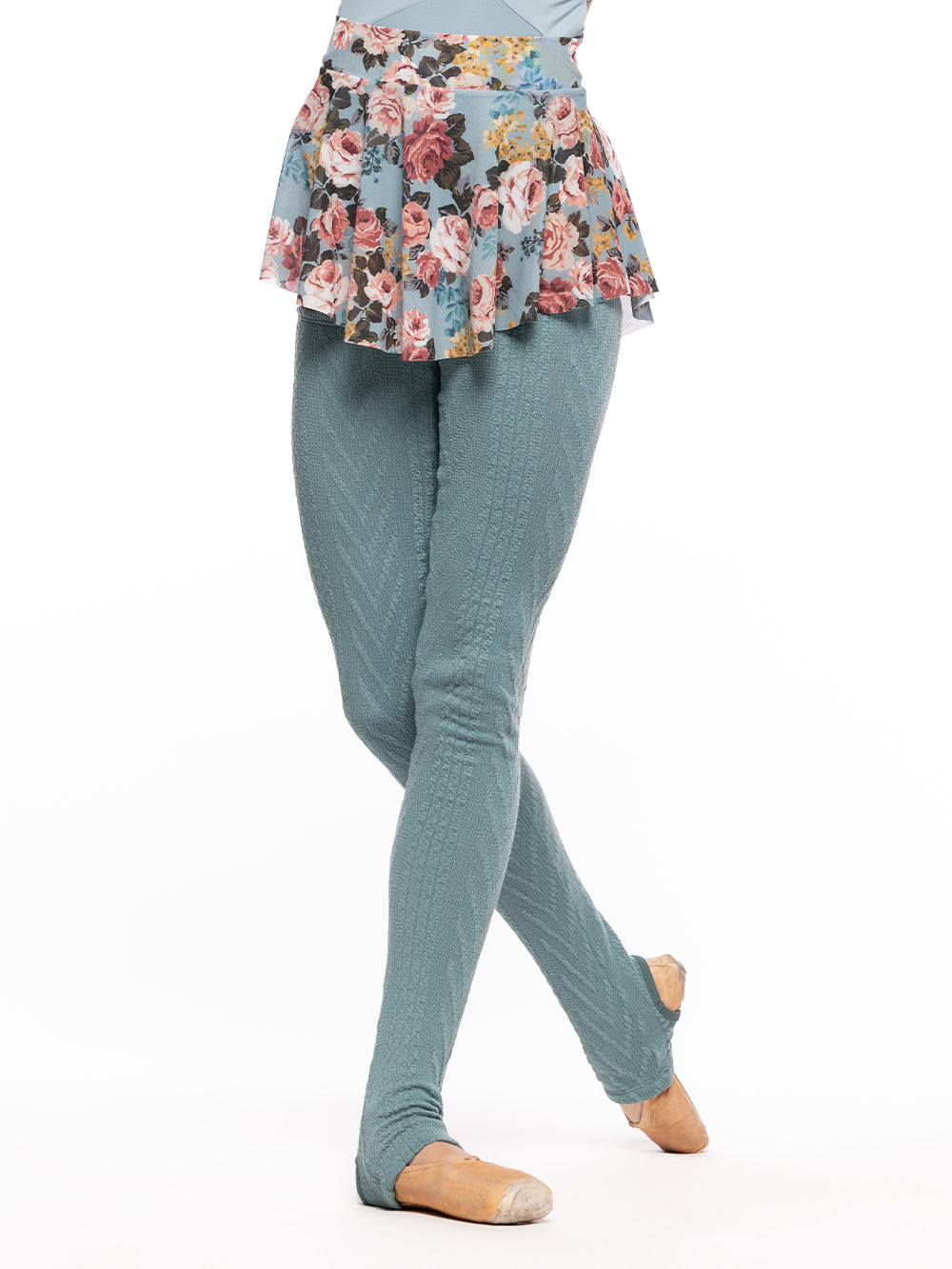 Model is wearing Ocean blue cable knit long leg warmers with a light blue leotard and light blue floral print mesh skirt