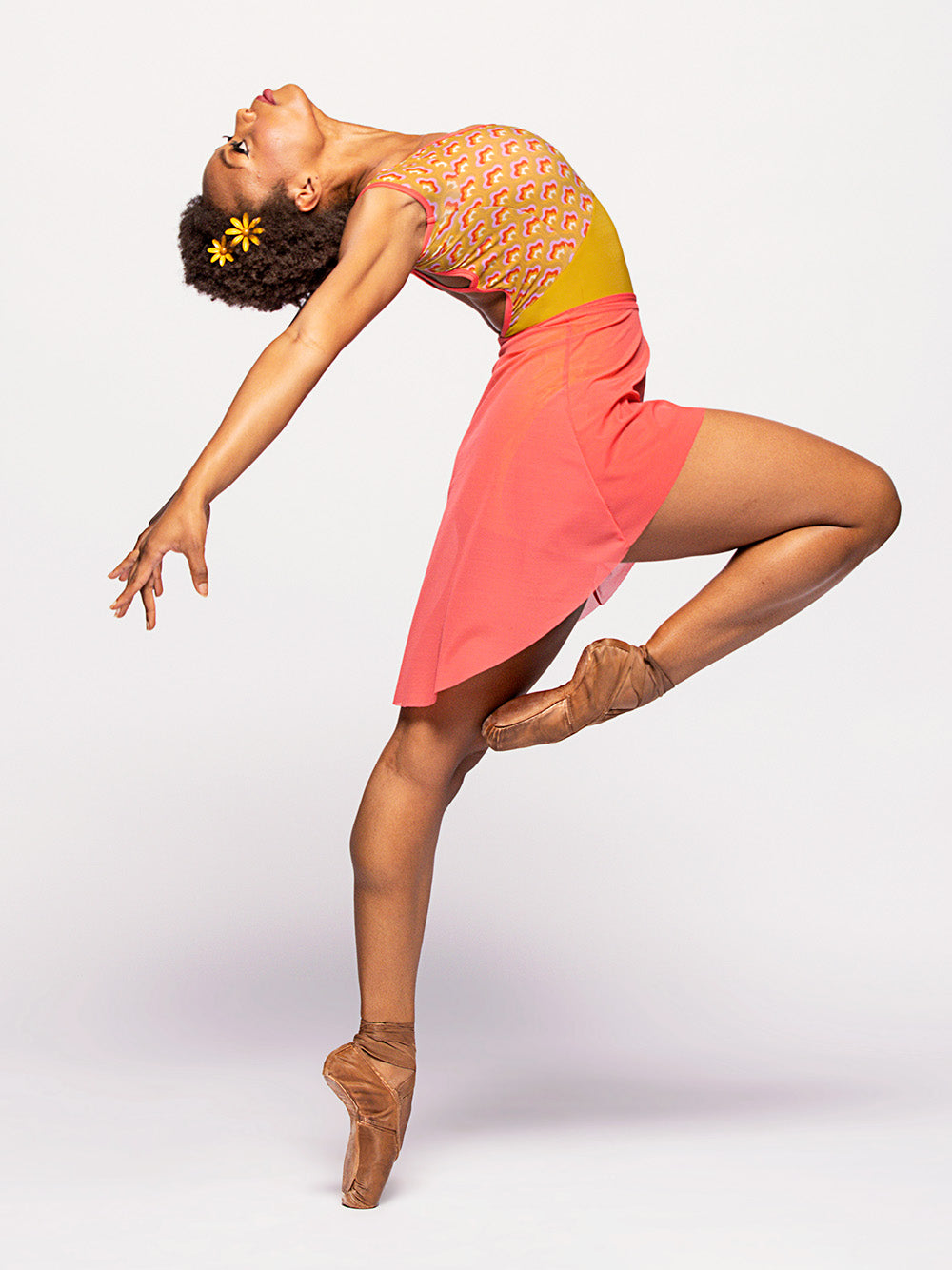 Model in Watermelon pink mesh skirt and pistachio green leotard with top print