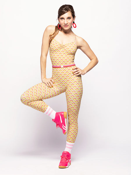 model in unitard with pistachio color base and stylized print   