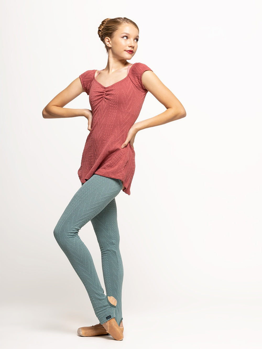 Model is wearing dark pink cable knit dress with pinch detail and Ocean blue knit leg warmers