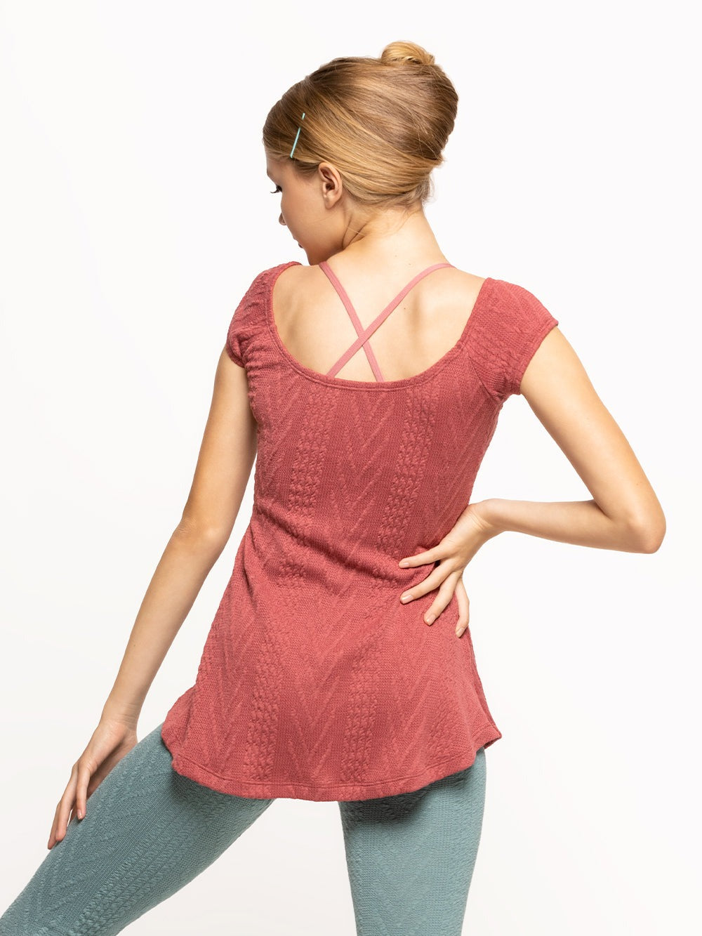 Back of model wearing dark pink cable knit dress with pinch detail and Ocean blue knit leg warmers
