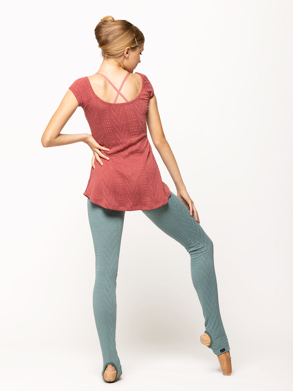 Back of model wearing Ocean blue cable knit long leg warmers with a Cinnamon dark pink cable knit Simone dress with pinch detail