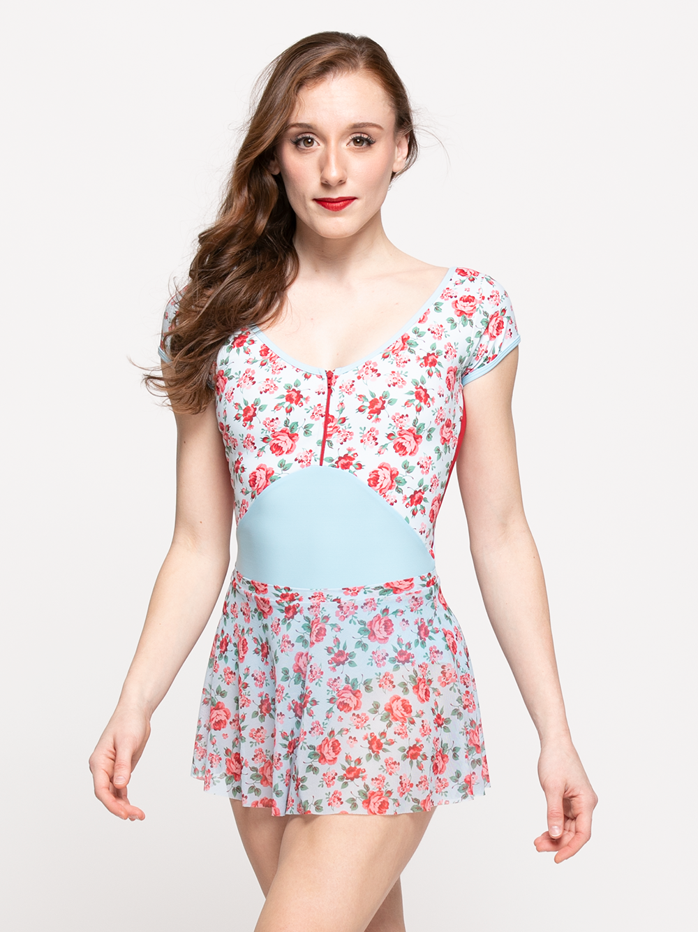model in true blue mesh skirt with red rose patterns