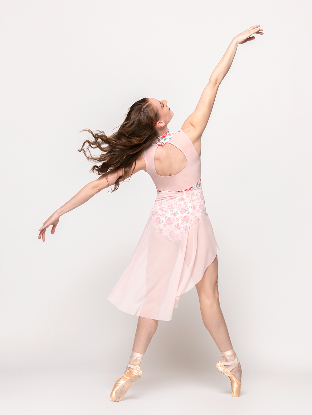 model showcasing back of  long light pink mesh skirt