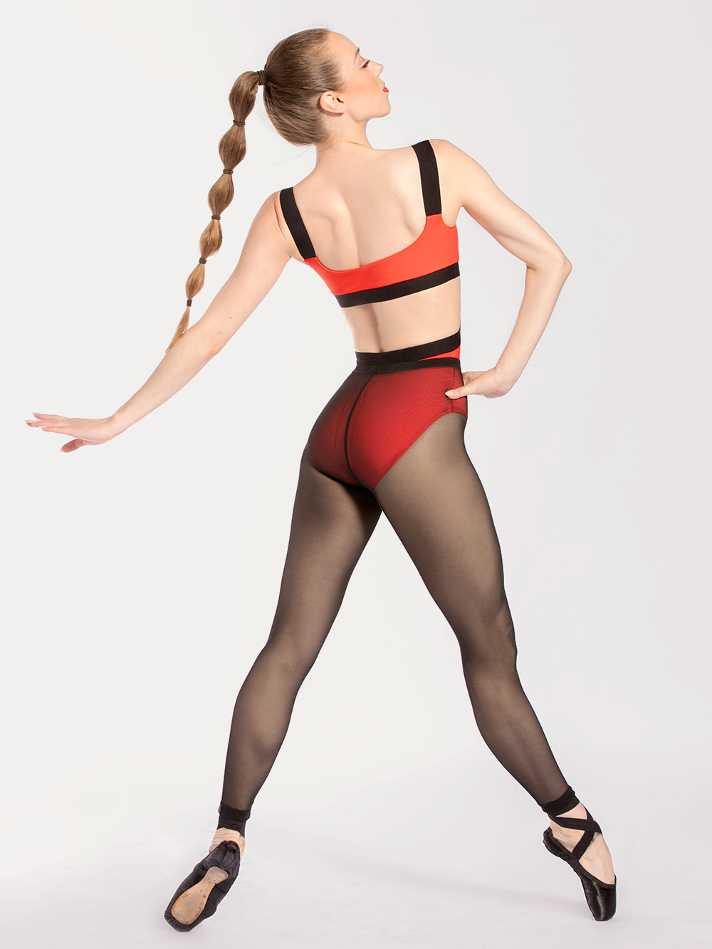 back of model showcasing back of leotard and mesh tights