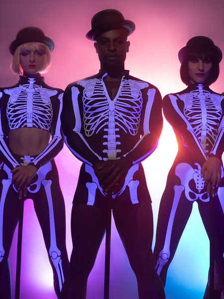 Three models - first in X-ray crop-top, second in X-ray skeleton Biketard with cane and bowler hat and last in X-ray Unitard 