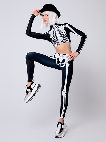 Model in X-Ray skeletons Crop-top leg raised in standing pose