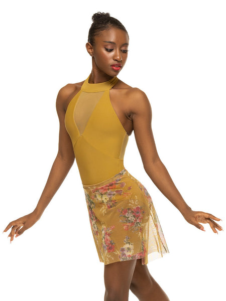 Model is wearing mustard yellow bodysuit with collared racerback and deep v mesh panel with matching yellow floral print skirt.